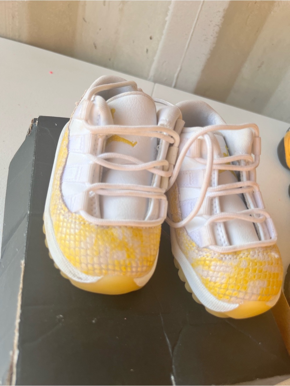 Retro 11’s size 5C. Kids White and Yellow Athletic Sneakers